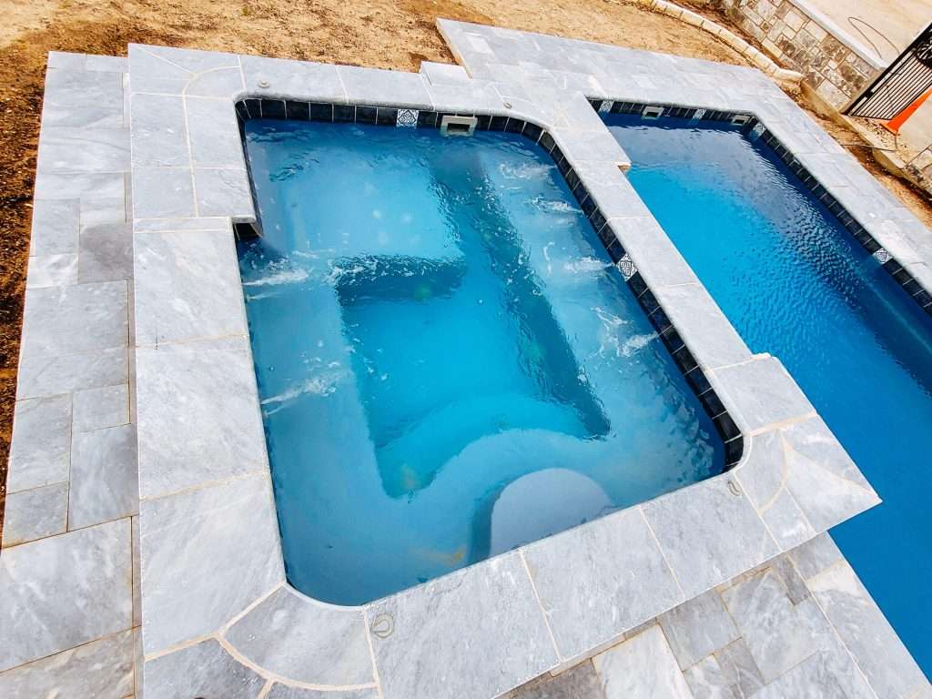 The Aspen masterfully crafted in-ground fiberglass swim spa measures 10′ x 8′