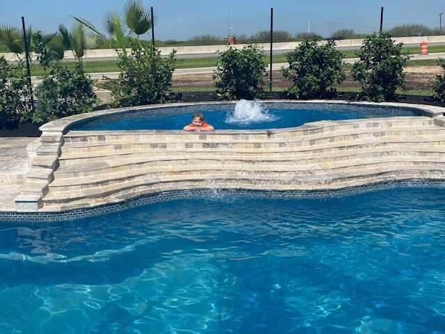 serenity-fiberglass-spa The Serenity in-ground pool spa measures 18'2” x 9’6”x10"
